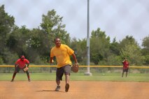 Richard Beverly throws out a pitch to the G-4 Bulldogs during the base championship game on July 1. Beverly was the pitcher for the eventual champion G-6 Sons of Pitchers. (U.S. Marine Corps photo by Cpl. Logan Snyder/Released)