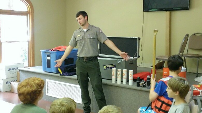 Center Hill Lake's Summer Ranger Dylan Hamlet talks with kids at Lighthouse Christian Camp July 7, 2015.  He visited the camp in Smithville, Tenn., each week and educated hundreds of campers on the importance of water safety.