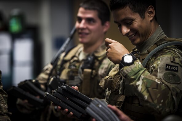 Airman 1st Class Ricardo Maggin, 1st Special Operations Security Forces Squadron deployed aircraft ground response element team member, prepares his gear before a task force exercise on Hurlburt Field, Fla., July 28, 2015. Exercise scenarios included downed aircraft site security and armed escort. Through the scenarios, DAGRE was able to accomplish multiple training objectives including close quarters combat, small unit tactics, flight deck denial, fly away security, close air support, casualty evacuation and more. (U.S. Air Force photo by Senior Airman Christopher Callaway)