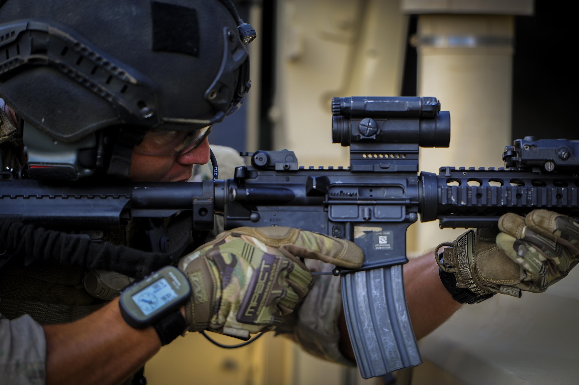 Senior Airman Daniel Santana, 1st Special Operations Security Forces Squadron deployed aircraft ground response element team member, provides cover fire during a task force exercise on Eglin Range Complex, Fla., July 27, 2015. Exercise scenarios included downed aircraft site security and armed escort. Through the scenarios, DAGRE was able to accomplish multiple training objectives including close quarters combat, small unit tactics, flight deck denial, fly away security, close air support, casual evacuation and more. (U.S. Air Force photo by Senior Airman Christopher Callaway)