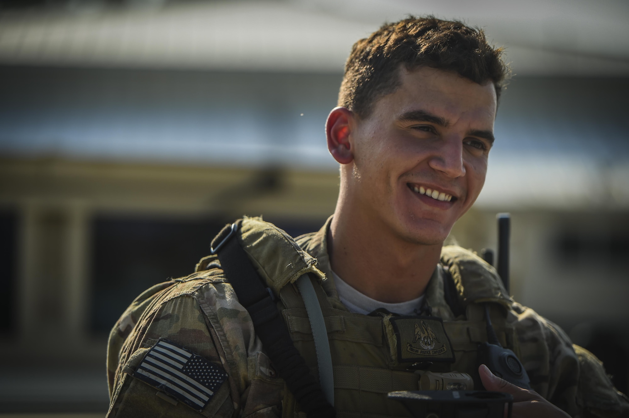 Senior Airman Daniel Santana, 1st Special Operations Security Forces Squadron deployed aircraft ground response element team member, responds to interview questions about his duties and experiences during a task force exercise on Eglin Range Complex, Fla., July 27, 2015. Exercise scenarios included downed aircraft site security and armed escort. Through the scenarios, DAGRE was able to accomplish multiple training objectives including close quarters combat, small unit tactics, flight deck denial, fly away security, close air support, casual evacuation and more. (U.S. Air Force photo by Senior Airman Christopher Callaway) 