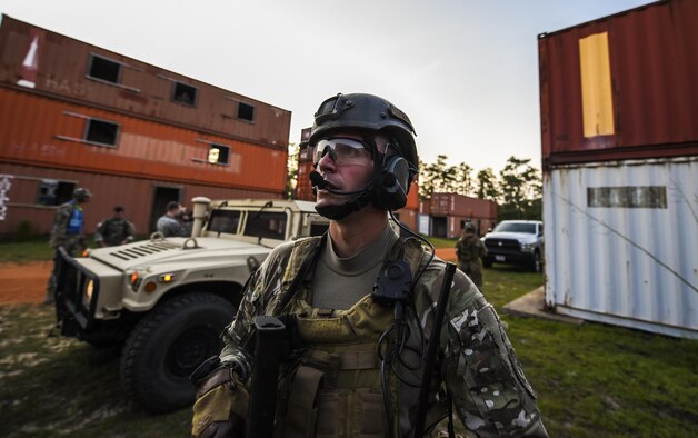 Senior Airman William Manis, 1st Special Operations Security Forces Squadron deployed aircraft ground response element team member, scans the terrain for hostile forces during a task force exercise on Eglin Range Complex, Fla., July 28, 2015. Exercise scenarios included downed aircraft site security and armed escort. Through the scenarios, DAGRE was able to accomplish multiple training objectives including close quarters combat, small unit tactics, flight deck denial, fly away security, close air support, casualty evacuation and more. (U.S. Air Force photo by Senior Airman Christopher Callaway)