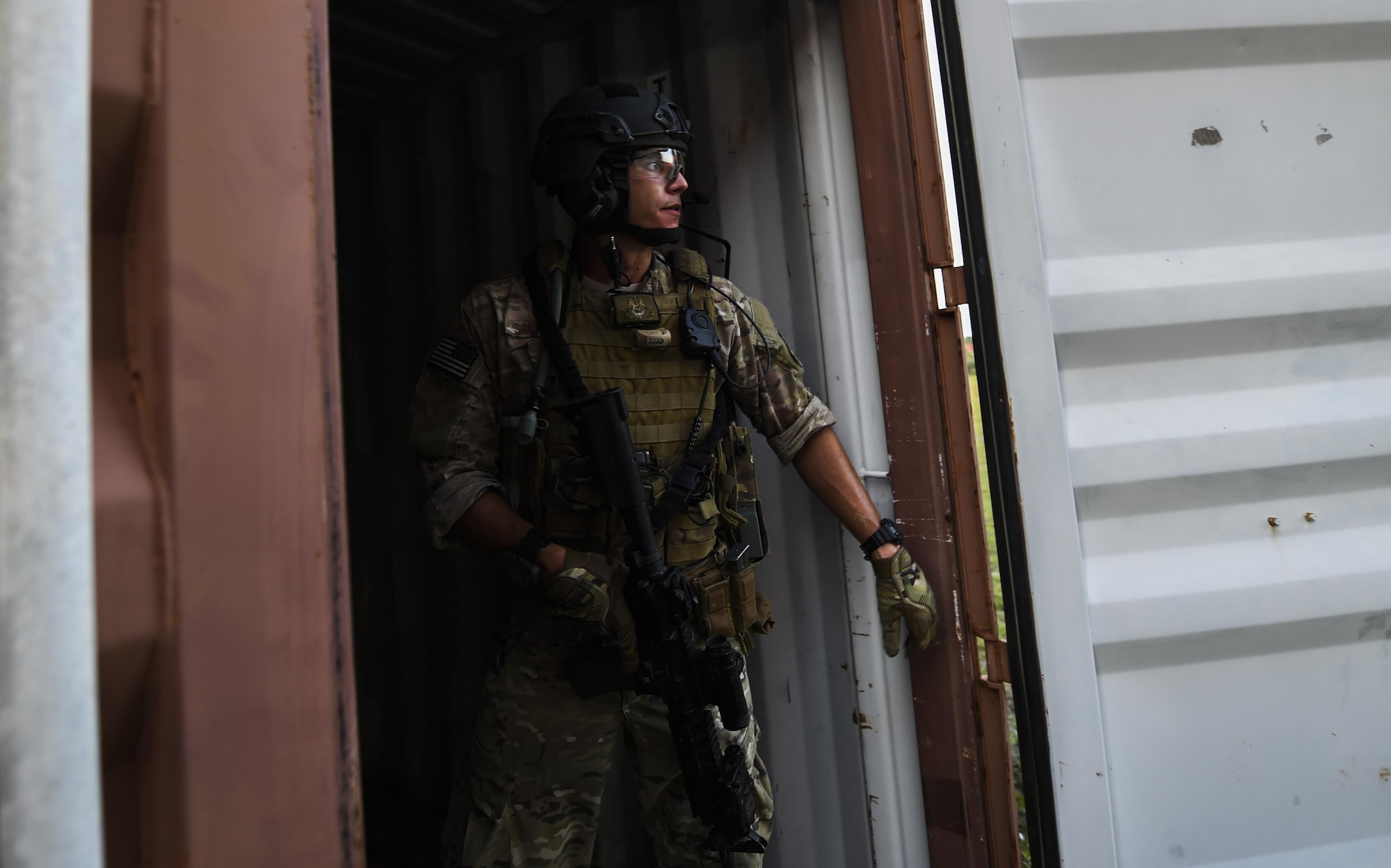 Senior Airman Daniel Santana, 1st Special Operations Security Forces Squadron deployed aircraft ground response element team member, provides cover during a task force exercise on Eglin Range Complex, Fla., July 28, 2015. Exercise scenarios included downed aircraft site security and armed escort. Through the scenarios, DAGRE was able to accomplish multiple training objectives including close quarters combat, small unit tactics, flight deck denial, fly away security, close air support, casual evacuation and more. (U.S. Air Force photo by Senior Airman Christopher Callaway)