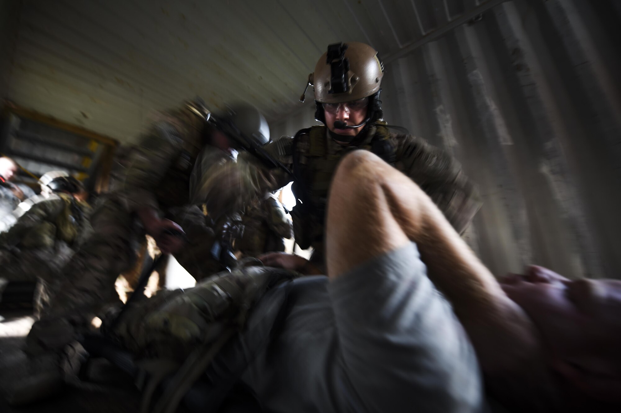 Senior Airman Jason Fernandez, 1st Special Operations Security Forces Squadron deployed aircraft ground response element team member, provides medical support to an injured victim during a task force exercise on Eglin Range Complex, Fla., July 28, 2015. Exercise scenarios included downed aircraft site security and armed escort. Through the scenarios, DAGRE was able to accomplish multiple training objectives including close quarters combat, small unit tactics, flight deck denial, fly away security, close air support, casual evacuation and more. (U.S. Air Force photo by Senior Airman Christopher Callaway)