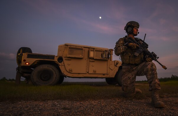 Senior Airman William Manis, 1st Special Operations Security Forces Squadron deployed aircraft ground response element team member, provides security during a task force exercise training mission on Eglin Range Complex, Fla., July 28, 2015. Exercise scenarios included downed aircraft site security and armed escort. Through the scenarios, DAGRE was able to accomplish multiple training objectives including close quarters combat, small unit tactics, flight deck denial, fly away security, close air support, casualty evacuation and more. (U.S. Air Force photo by Senior Airman Christopher Callaway)