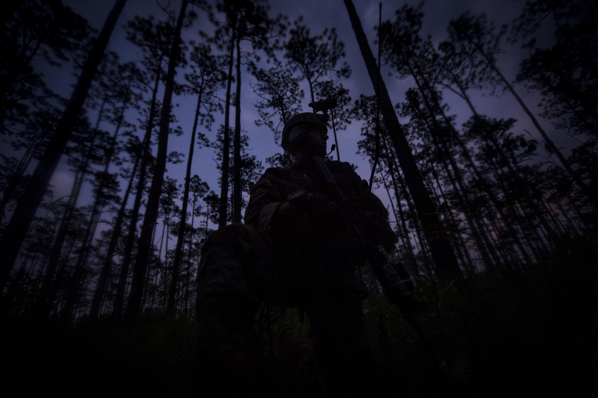Senior Airman Daniel Willens, 1st Special Operations Security Forces Squadron deployed aircraft ground response element team member, provides security during a task force exercise on Eglin Range Complex, Fla., July 27, 2015. Exercise scenarios included downed aircraft site security and armed escort. Through the scenarios, DAGRE was able to accomplish multiple training objectives including close quarters combat, small unit tactics, flight deck denial, fly away security, close air support, casual evacuation and more. (U.S. Air Force photo by Senior Christopher Callaway)