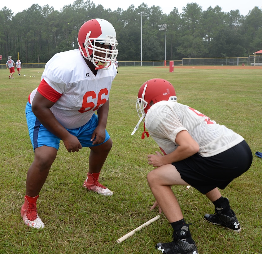 Members of the Sherwood Christian Academy, Albany, Ga., football team practice drills recently during a weeklong training camp held at Marine Corps Logistics Base Albany.