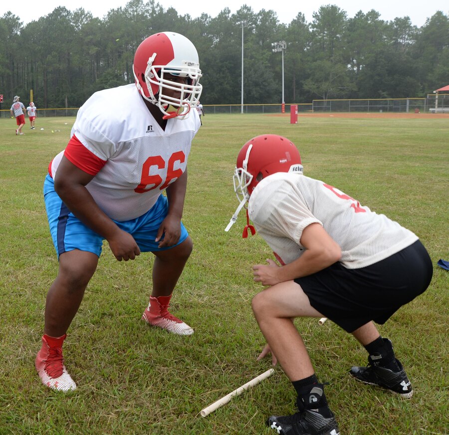Members of the Sherwood Christian Academy, Albany, Ga., football team practice drills recently during a weeklong training camp held at Marine Corps Logistics Base Albany.