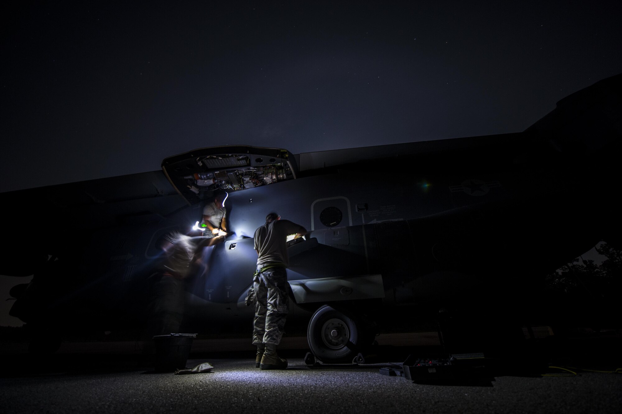 Maintainers with the 801st Special Operations Aircraft Maintenance Squadron flush a CV-22B Osprey fuel line during routine repairs on the Eglin Range Complex, Fla., July 29, 2015. The maintainers were flown out to the range to repair a CV-22B Osprey that was an integral part of a recent six-day task force exercise at Hurlburt Field, Fla. (U.S. Air Force photo/Senior Airman Christopher Callaway)
