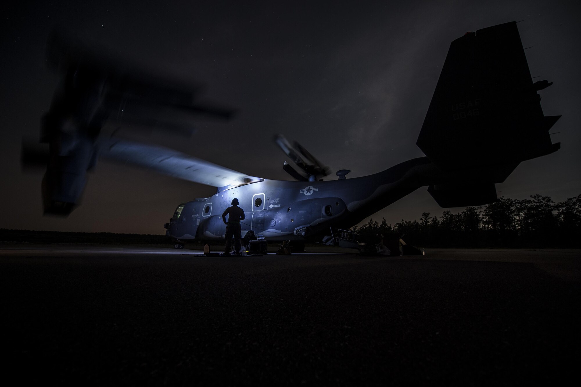 A CV-22B Osprey’s wings position from “full stow” to “take-off and landing” modes during an operational check after routine maintenance on Eglin Range Complex, Fla., July 29, 2015. The Osprey played an integral role for casualty evacuation training during the recent six-day task force exercise at Hurlburt Field, Fla. (U.S. Air Force photo/Senior Airman Christopher Callaway)