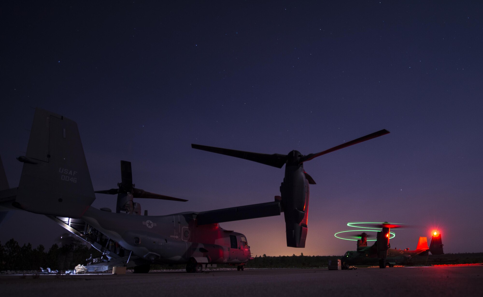 Maintainers with the 801st Special Operations Aircraft Maintenance Squadron were flown out to Eglin Range Complex, Fla., to perform routine repairs on a CV-22B Osprey, July 28, 2015. The Osprey played an integral role during a recent task force exercise at Hurlburt Field, Fla. (U.S. Air Force photo/Senior Airman Christopher Callaway)
