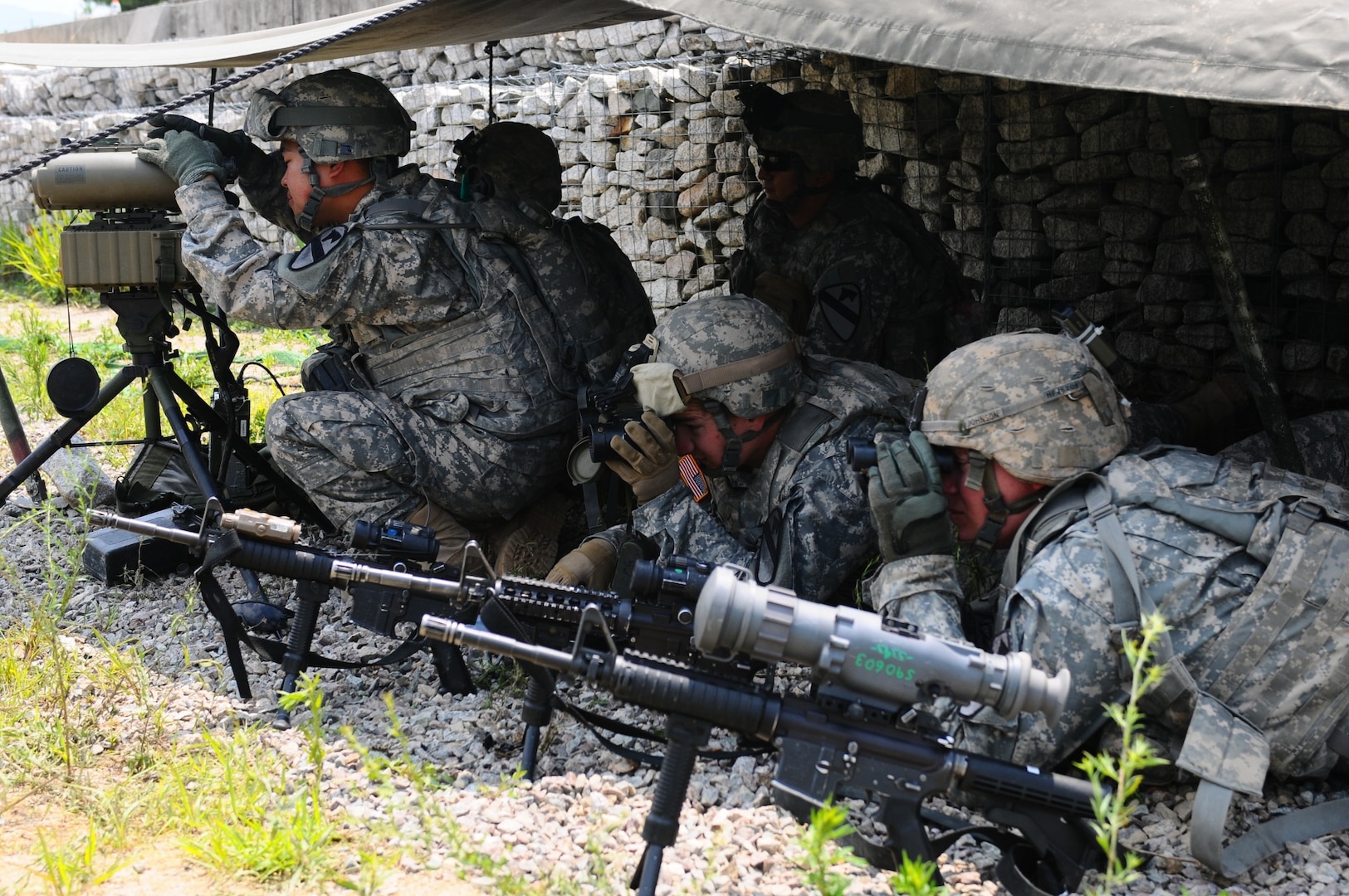 In this file photos, soldiers of Fire Support Team, B Battery, 3rd Battalion, 16th Field Artillery Regiment, 2nd Armored Brigade Combat Team, 1st Cavalry Division, is seeking enemy artillery fires and ensuring safe landing of friendly fires in during a joint live-fire exercise July 12-17, 2015 at Rodriguez Live Fire Complex in Cheorwon, South Korea.  