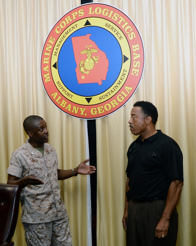 Donny Green, (right) transportation specialist, Marine Corps Logistics Base Albany, receives recognition from Col. James C. Carroll III, commanding officer, Marine Corps Logistics Base Albany, for his efforts to keep the community safe. Green observed uncovered manholes in Holloway Park, Albany, Ga., and reported the unsafe condition to the City of Albany’s Recreation and Parks Department.