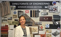 Patricia Mooneyham, a chief in the Interior Design Section, at the Engineering and Support Center, Huntsville, stands in front of an interior design sample board Wednesday, which was designed by several interior designers. Mooneyham will be presented with the U.S. Army Corps of Engineers 2015 Interior Designer of the Year award in August at the Huntsville Center.