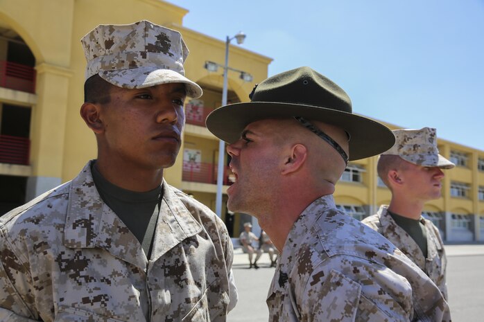 Recruit Raul Hernandez, Alpha Company, 1st Recruit Training Battalion, displays his bearing as Sgt. Andrew T Deaveiro, drill instructor questions him during the Series Commander’s Inspection at Marine Corps Recruit Depot San Diego, Aug. 3. As training progresses and recruits endure more of the events that help them build confidence, they will continue to become more proficient at handling stressful situations and understand how an official inspection is run. Today, all males recruited from west of the Mississippi are trained at MCRD San Diego. The depot is responsible for training more than 16,000 recruits annually. Alpha Company is scheduled to graduate Sept. 4.