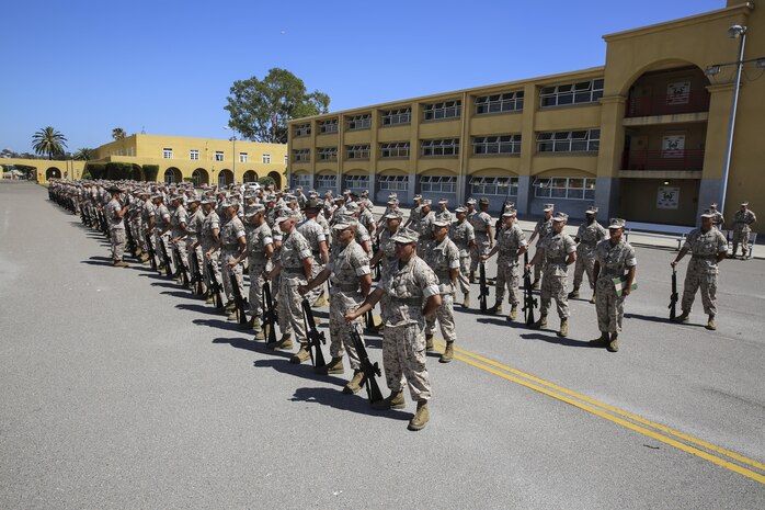 Recruits of Alpha Company, 1st Recruit Training Battalion, stand at parade rest and wait for their turn to be inspected during the Series Commander Inspection at Marine Corps Recruit Depot San Diego, Aug. 3. While being inspected, recruits were asked questions that pertained to things they learned while in recruit training. When the inspecting officer also asked recruits questions they sometimes were more personal nature such as how recruit training was going or what the recruit’s favorite part has been to that point. Today, all males recruited from west of the Mississippi are trained at MCRD San Diego. The depot is responsible for training more than 16,000 recruits annually. Alpha Company is scheduled to graduate Sept. 4.