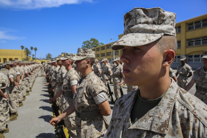 Recruits of Alpha Company, 1st Recruit Training Battalion, stand at parade rest and wait for their turn to be inspected during the Series Commander Inspection at Marine Corps Recruit Depot San Diego, Aug. 3. While being inspected, recruits were asked questions that pertained to things they learned while in recruit training. When the inspecting officer also asked recruits questions they sometimes were more personal nature such as how recruit training was going or what the recruit’s favorite part has been to that point. Today, all males recruited from west of the Mississippi are trained at MCRD San Diego. The depot is responsible for training more than 16,000 recruits annually. Alpha Company is scheduled to graduate Sept. 4.