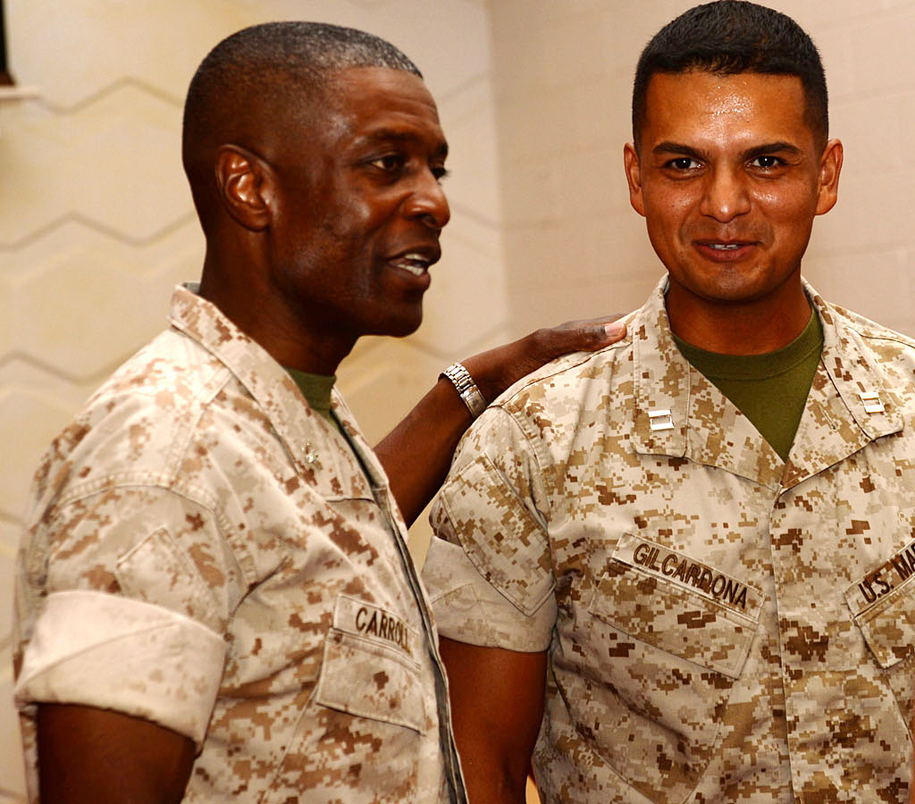 Col. James C. Carroll III, commanding officer, Marine Corps Logistics Base Albany, congratulates Capt. Cesar Gilcardona, logistics officer, on his new role as MCLB Albany’s Headquarters and Support Company’s leader. Gilcardona took the helm during a ceremony at the installation’s Chapel of the Good Shepherd, Aug. 6. Gilcardona replaced Capt. George McDonnell, deputy staff judge advocate. McDonnell handed Gilcardona the company’s colors signifying the change of command.