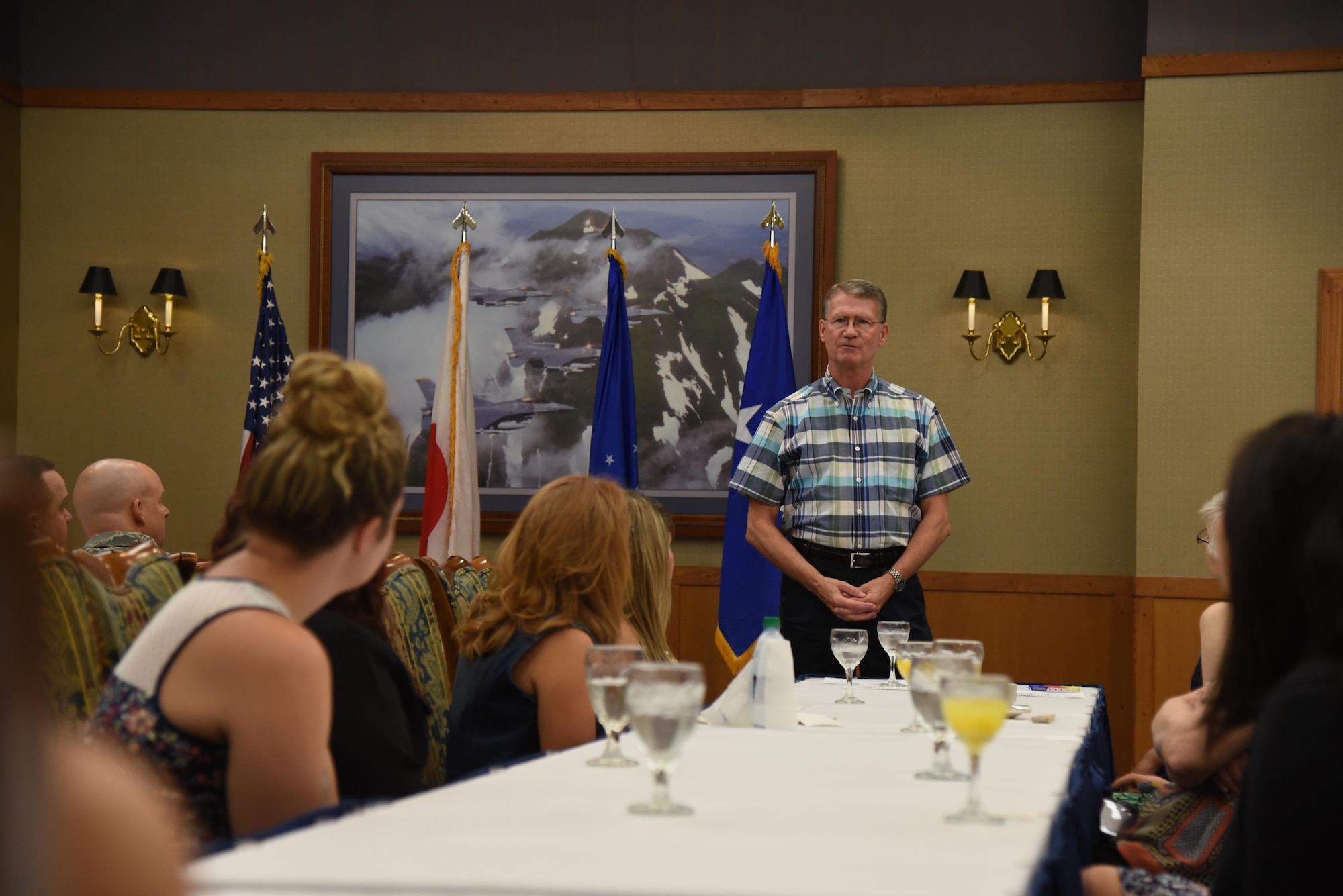 Retired U.S. Air Force Maj. Gen. David Robinson, speaks with members of Misawa’s Key Spouse group during a visit to the base, Aug. 5, 2015. Robinson was joined by his wife, Pacific Air Forces Commander Gen. Lori Robinson, and spoke about the important contributions spouses have on the mission and resiliency of Airmen. (U.S. Air Force photo by Senior Airman Patrick S. Ciccarone/Released)
