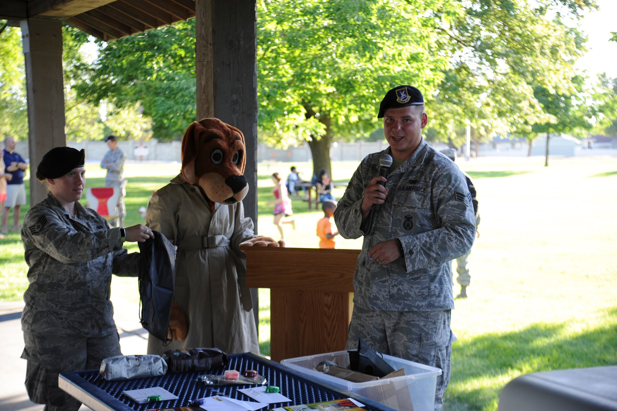 Senior Airman Timothy Riley, 92nd Security Forces police services program manager, announces raffle winners during the National Night Out event held at Miller Park Aug. 4, 2015, at Fairchild Air Force Base, Wash. The raffle prizes ranged from laser tag for the kids to gym memberships and a $100 gift card to the Base Exchange for adults. (U.S. Air Force photo/Airman 1st Class Nicolo J. Daniello)
