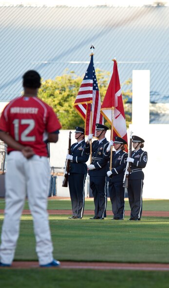 Members of the 141st Air Refueling Wing honor guard present the colors during the All-Star baseball game at Avista Stadium in Spokane, Wash., Aug. 4, 2015. Members of the Air Force and Air National Guard presented flags preceding the annual Short Season Single A All-Star game. (U.S. Air Force photo/Airman Sean Campbell)