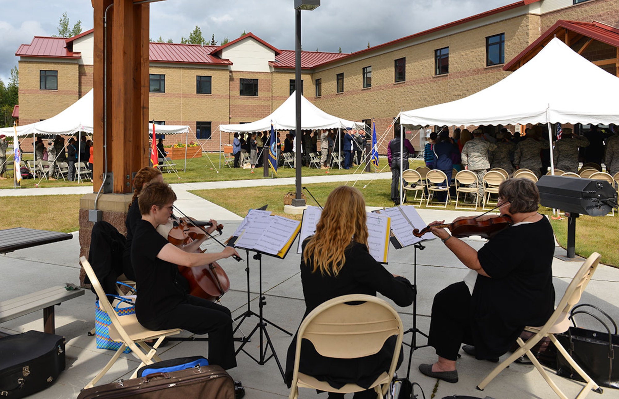 A string quartet plays the National Anthem at the Fisher House Annex dedication ceremony July 28. (U.S. Air Force photo/Airman 1st class Kyle Johnson)