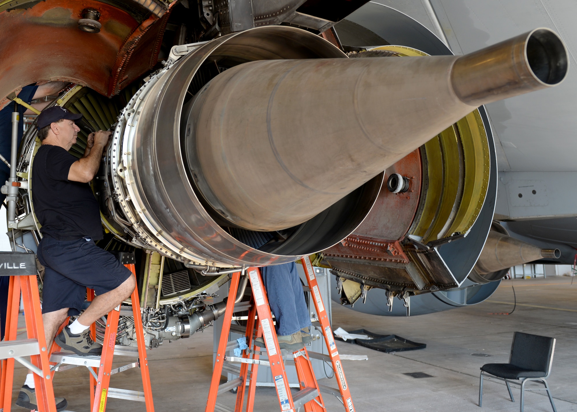 ALTUS AIR FORCE BASE, Okla. – Juan Tejeda, KC-135 Stratotanker refueling aircraft engine flightline maintainer, inspects a newly swapped engine of a U.S. Air Force KC-135 Stratotanker refueling aircraft in Hangar 285, July 28, 2015. The 97th Maintenance Directorate’s mission is important because it allows Altus’ mission of training to continue. (U.S. Air Force photo by Airman 1st Class Kirby Turbak/Released)