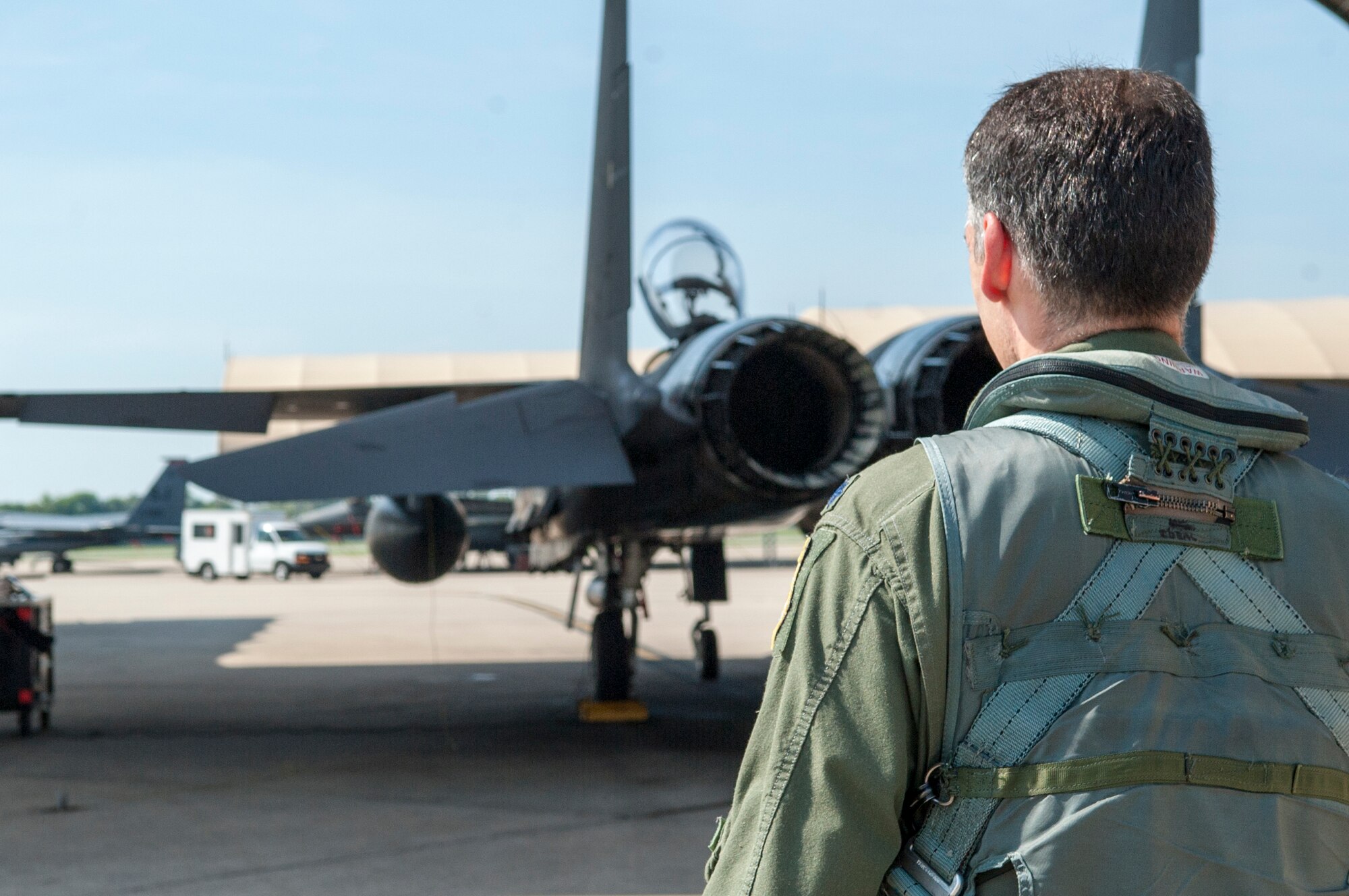 Lt. Col. Paul Hibbard, 333rd Fighter Squadron instructor pilot, approaches an F-15E Strike Eagle to conduct a training sortie, July 22, 2015, at Seymour Johnson Air Force Base, North Carolina. During the flight, Hibbard achieved a career milestone of flying 3,000 hours in the F-15E. (U.S. Air Force photo/Airman Shawna L. Keyes)