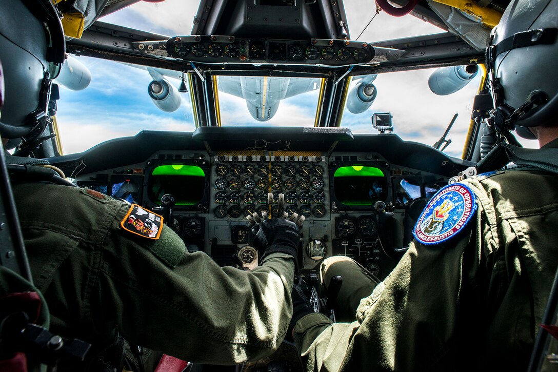 A B-52H Stratofortress pilot and copilot practice an aerial refueling with a KC-135 Stratotanker on July 10, Barksdale Air Force Base, La. The B-52 is assigned to the Air Force Reserve Command's 307th Bomb Wing, which hosts the only schoolhouse where Reserve and Active Duty aircrew learn to fly the B-52. (U.S. Air Force photo by Master Sgt. Greg Steele/Released)