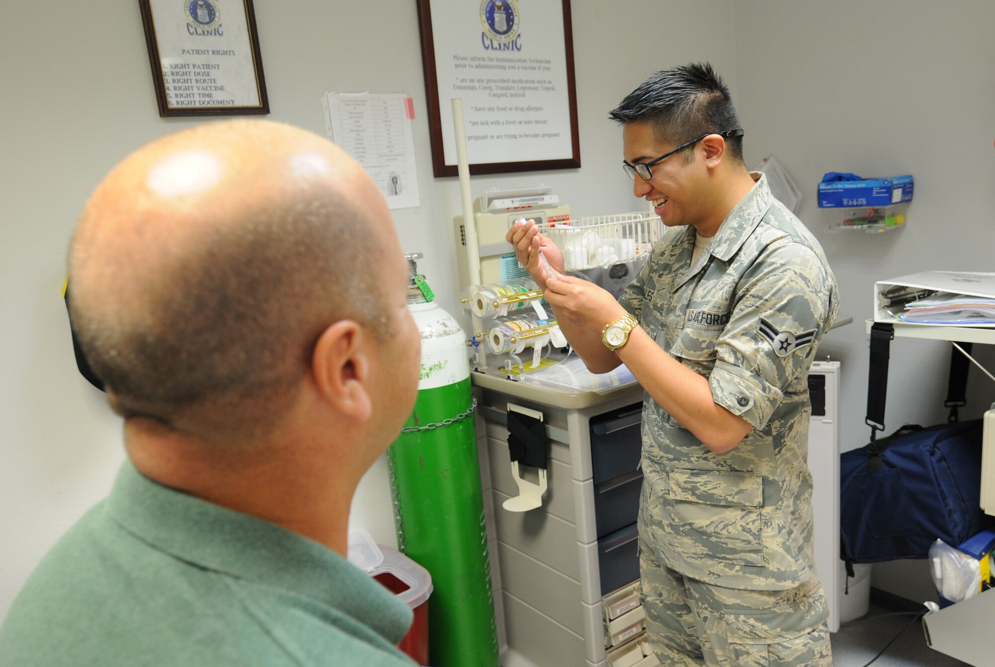 A picture of U.S. Air Force Airman 1st Class William Sales, an aerospace medical technician from the New Jersey Air National Guard's 177th Medical Group, demonstrating proper immunization techniques.