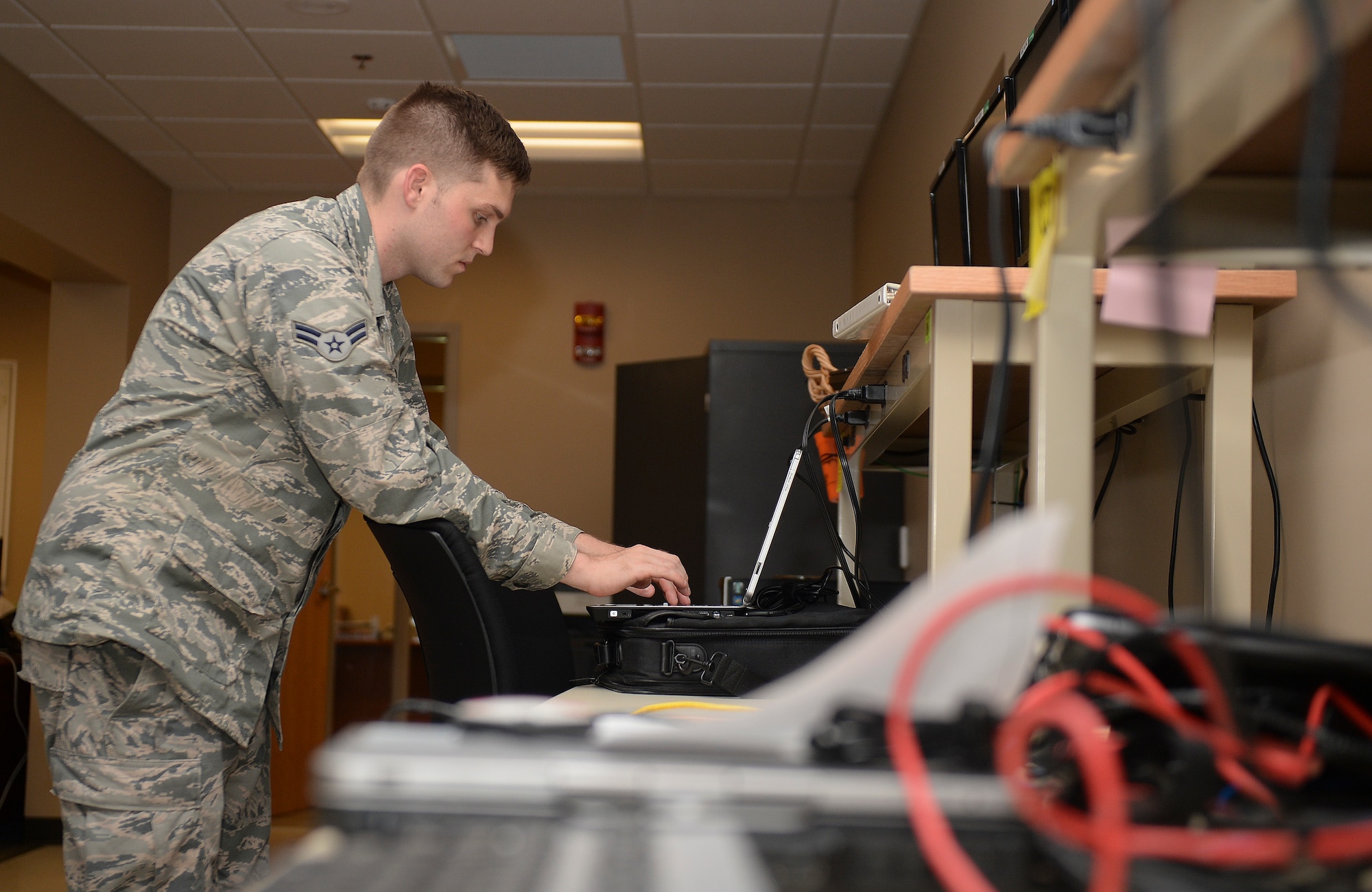 Airman 1st Class Tyler Ullrich, 22nd Communications Squadron client systems technician, configures a virtual private network, Aug. 8, 2015, at McConnell Air Force Base, Kan. Setting up a VPN allows members of Team McConnell to access the base network while they are away from their work stations. (U.S. Air Force photo by Senior Airman Colby L. Hardin) 