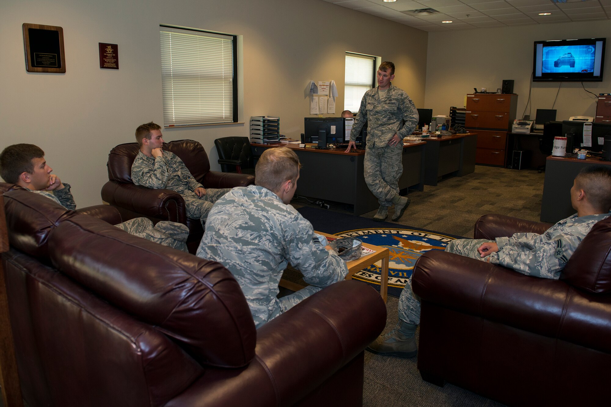 U.S. Air Force Staff Sgt. Kegan Davis, 23d Civil Engineer Squadron airman dormitory leader, speaks with bay orderlies Aug. 6, 2015, at Moody Air Force Base, Ga. Dorm residents maintain the facilities when assigned by their unit through the Bay Orderly Program. (U.S. Air Force photo by Airman 1st Class Kathleen D. Bryant/ Released)
