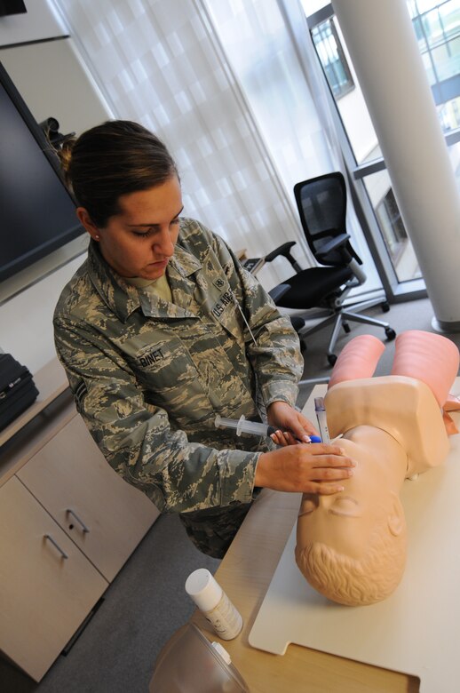 A picture of U.S. Air Force Senior Airman Taylor Binet, an aerospace medical technician with the New Jersey Air National Guard's 177th Medical Group, conducting ambulance service training.