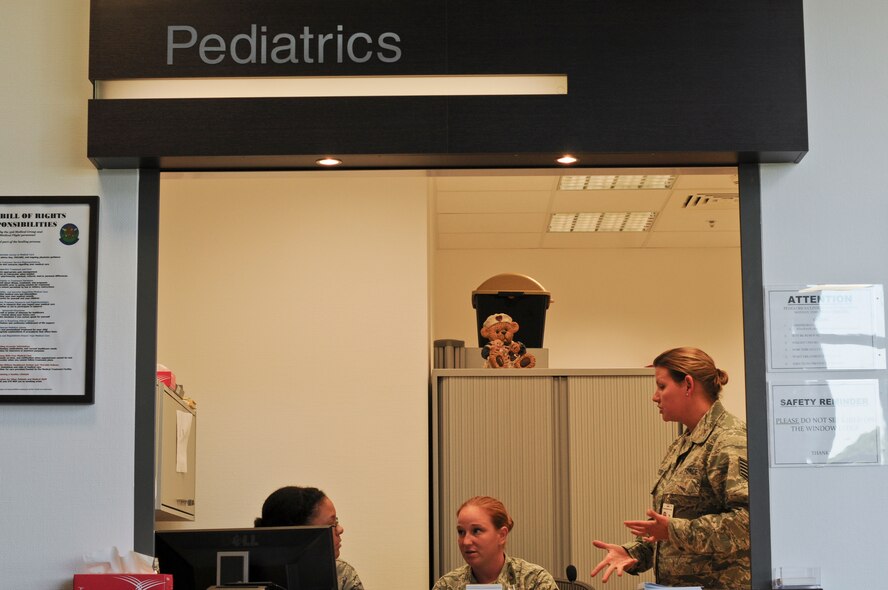 From left, U.S. Air Force Staff Sgt. Audrey Scruggs from the 52nd Medical Group, shows appointment scheduling techniques to U.S. Air Force Master Sgt. Kara Kauffman and Tech. Sgt. Melissa Blackledge from the New Jersey Air National Guard's 177th Medical Group, Aug. 3, at the pediatrics department in the medical clinic on Spangdahlem Air Base, Germany. Members from the 177th Medical Group are working hand-in-hand with the active-duty force to sharpen their skills and ensure mission readiness. (U.S. Air National Guard photo by Shane S. Karp/Released)