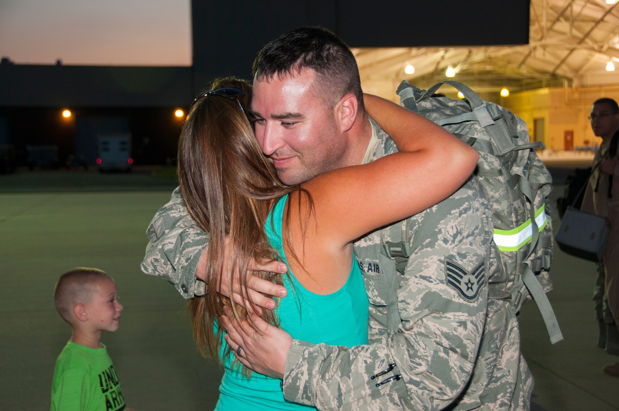Staff Sgt. Jason Amer, Production Controller with the 108th Maintenance Squadron, hugs his wife Heather at Joint Base McGuire-Dix-Lakehurst, N.J., August 5, 2015. More than 30 Airmen from the 108th Wing, New Jersey Air National Guard, returned home from a two-month deployment in support of Operations Freedom's Sentinel and Enduring Freedom in the Central Command area of operations. The Airmen were greeted by Brig. Gen. Michael L. Cunniff, the Adjutant General of New Jersey and Col. Robert A. Meyer Jr., Commander, 108th Wing and a group of more than 50 friends, family and Guard members. (U.S. Air National Guard photo by Master Sgt. Carl Clegg/Released)