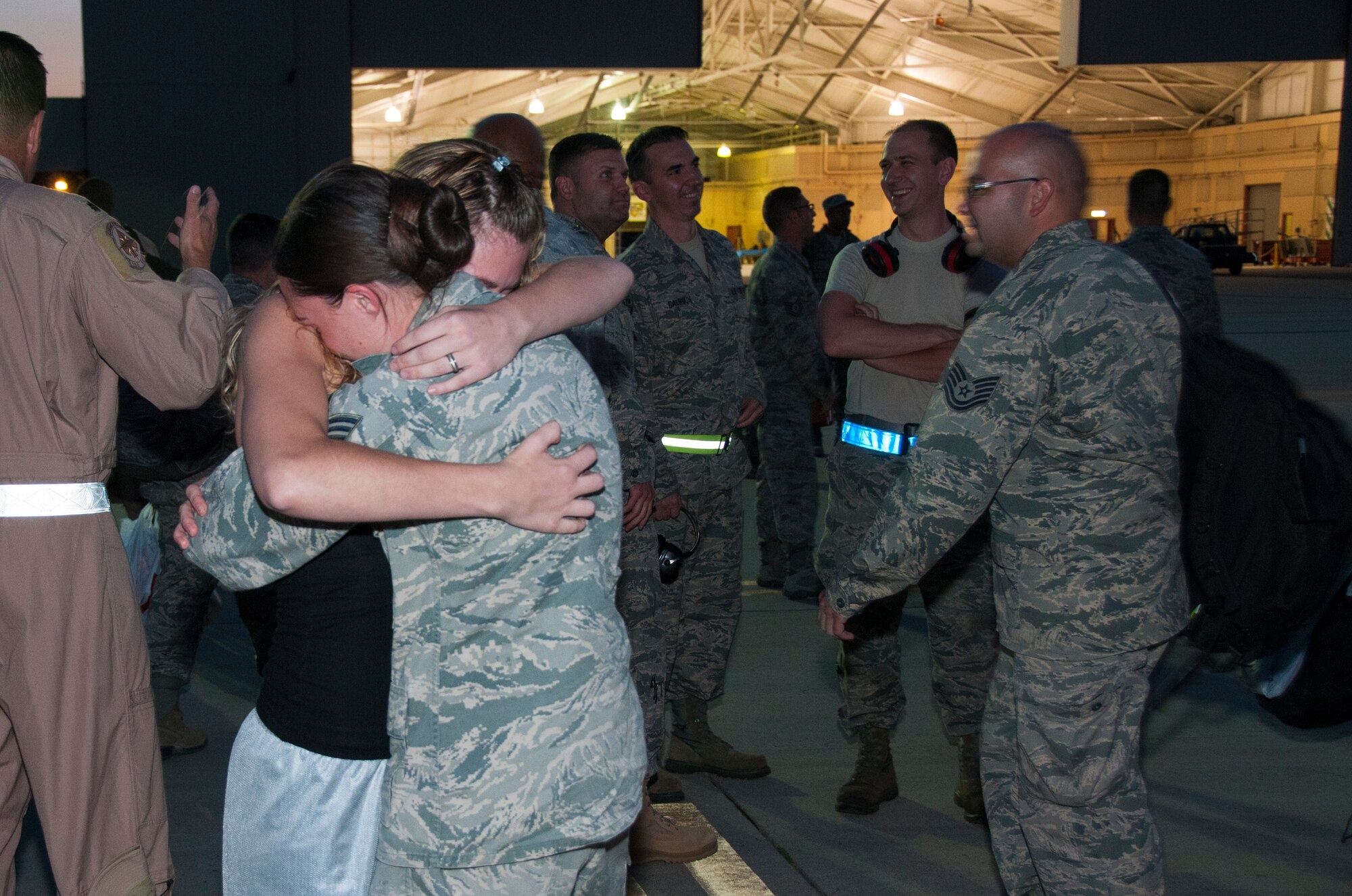 Staff Sgt. Megan Fisher, Supply Systems Analyst with the 108th Maintenance Squadron is welcomed home by her wife Erin  at Joint Base McGuire-Dix-Lakehurst, N.J., August 5, 2015. More than 30 Airmen from the 108th Wing, New Jersey Air National Guard, returned home from a two-month deployment in support of Operations Freedom's Sentinel and Enduring Freedom in the Central Command area of operations. The Airmen were greeted by Brig. Gen. Michael L. Cunniff, the Adjutant General of New Jersey and Col. Robert A. Meyer Jr., Commander, 108th Wing and a group of more than 50 friends, family and Guard members. (U.S. Air National Guard photo by Master Sgt. Carl Clegg/Released) (This image was cropped to focus on the subject of the image)