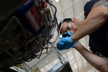 Sammy Farhat, 47th Flying Training Wing Maintenance Directorate maintainer, inspects a T-1A Jayhawk on Laughlin Air Force Base, Texas, July 28, 2015. The Directorate maintains the second largest active air fleet in the Air Force with 48 T-1A Jayhawks, 104 T-6A Texan IIs, and 65 T-38C Talons, 20 of which support the Introduction to Fighter Fundamentals mission. (U.S. Air Force photo by Airman 1st Class Ariel D. Partlow)(Released) 