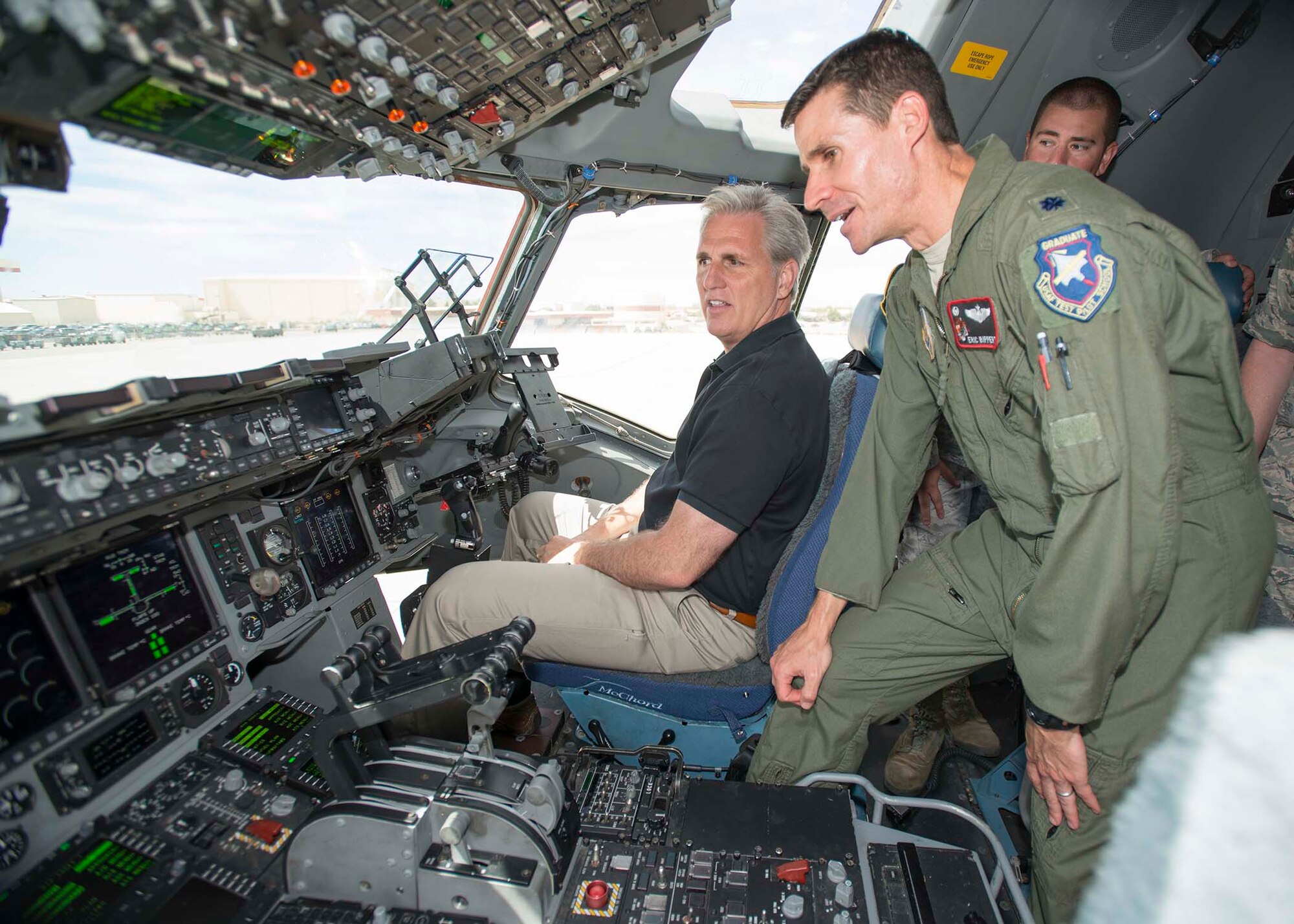 Lt. Col. Eric Bippert, 418th Flight Test Squadron commander, shows Congressman Kevin McCarthy the cockpit of a C-17 Globemaster III. McCarthy visited Edwards AFB Aug. 5 and received mission updates on 412th Test Wing programs such as F-35 and KC-46. He also visited Ridley Mission Control. McCarthy serves California’s 23rd district and is currently the majority leader in the U.S. House of Representatives. He was first elected to Congress in 2006 and is a native of Bakersfield, California, and a fourth-generation Kern County resident. (U.S. Air Force photo by Brad White) 