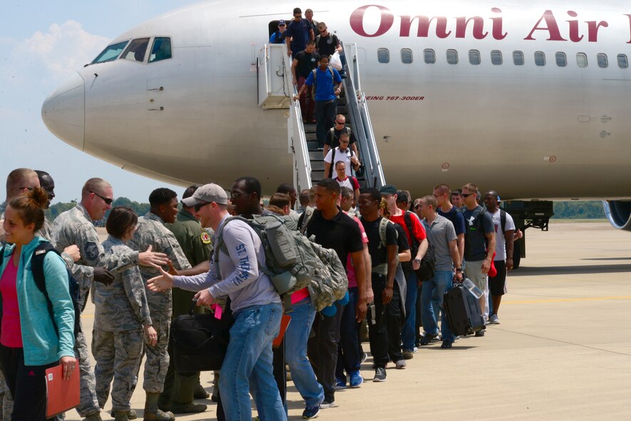 Airmen are congratulated as they return to Barksdale Air Force Base, La., Aug. 4, 2015, from a routine training exercise. Training missions keep Barksdale Airmen proficient and mission ready at all times. (U.S. Air Force photo/Airman 1st Class Luke Hill)