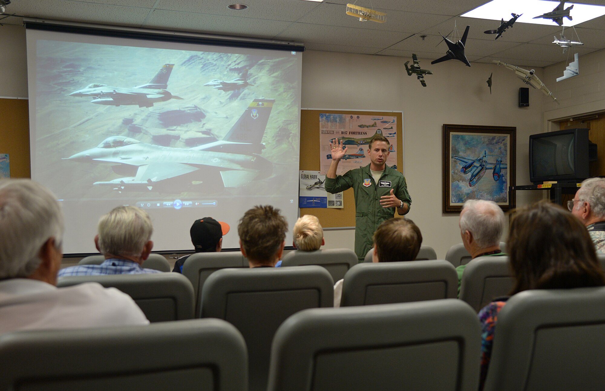 Capt. Jay Doerfler talks with local teenagers and their grandparents about what drove him to Air Force service, his personal aspirations to become an aviator, and his experiences as an F-16 fighter pilot. (U.S. Air Force photo by Alex R. Lloyd)