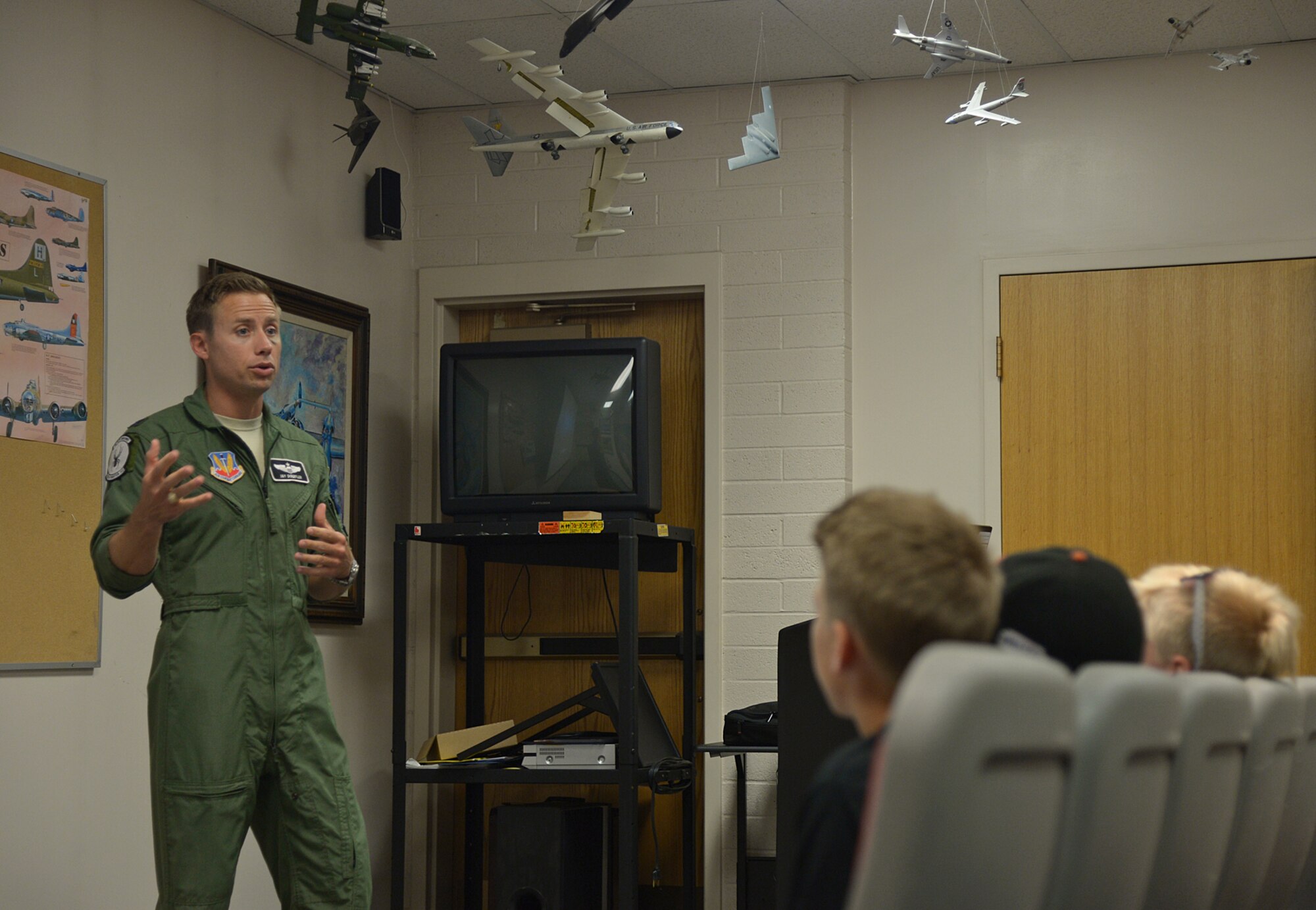 Capt. Jay Doerfler talks with local teenagers and their grandparents about what drove him to Air Force service, his personal aspirations to become an aviator, and his experiences as an F-16 fighter pilot. (U.S. Air Force photo by Alex R. Lloyd)