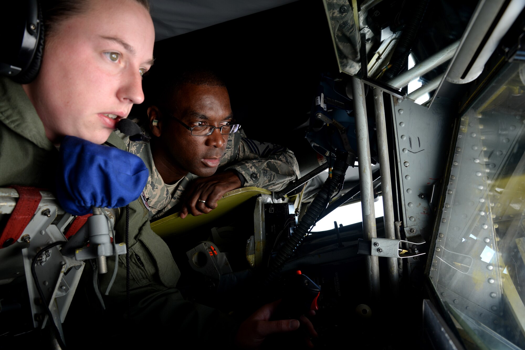 U.S. Air Force Chief Master Sgt. James Davis, right, U.S. Air Forces in Europe and Air Forces in Africa commande chief, observes as U.S. Air Force Senior Airman Danielle Repp, 351st Air Refueling Squadron boom operator from Spokane, Wash., refuels an F-15 Eagle Aug. 5, 2015, over Norfolk, England.  Davis and U.S. Air Force Gen. Frank Gorenc, USAFE-AFAFRICA commander, visited several facilities and a variety of Airmen for a better understanding of Team Mildenhall and its mission. The aircrew refueled 12 F-15s that day to start the leaders’ immersion tour. (U.S. Air Force photo by Senior Airman Kate Thornton/Released)