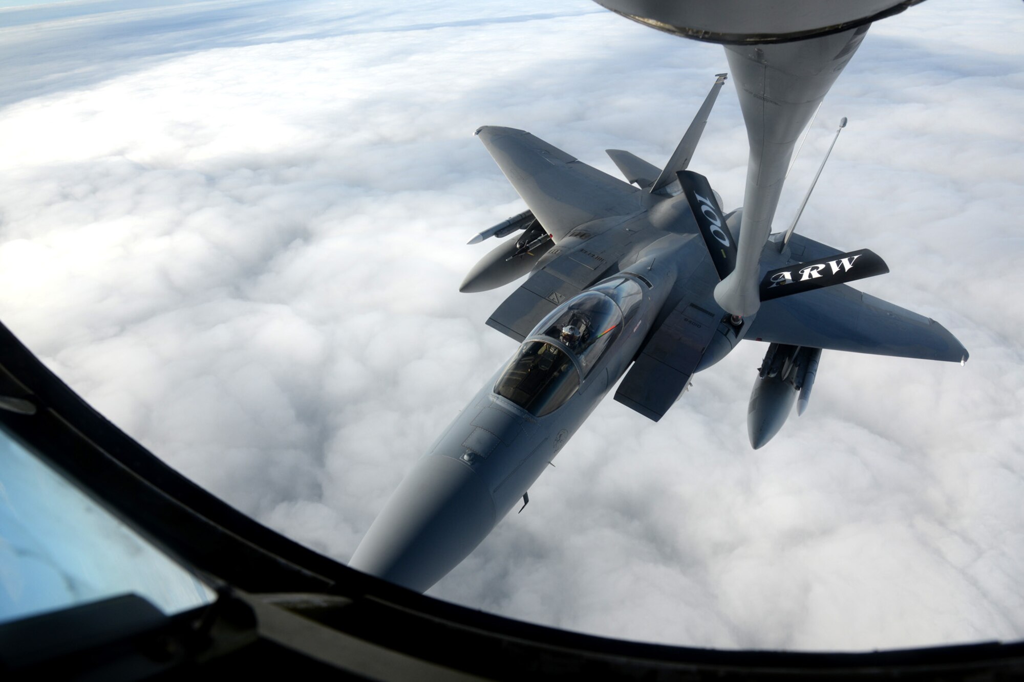 A KC-135 Stratotanker assigned to the 351st Air Refueling Squadron refuels an F-15 Eagle assigned to the 48th Fighter Wing Aug. 5, 2015, over Norfolk, England. The 351st ARS provides KC-135 Stratotankers for training, operational air refueling, aeromedical evacuation, and airlift missions for US and NATO fighter, bomber, support, and reconnaissance aircraft in the airspace over the Atlantic Ocean, Europe, Africa and Southwest Asia. (U.S. Air Force photo by Senior Airman Kate Thornton/Released)
