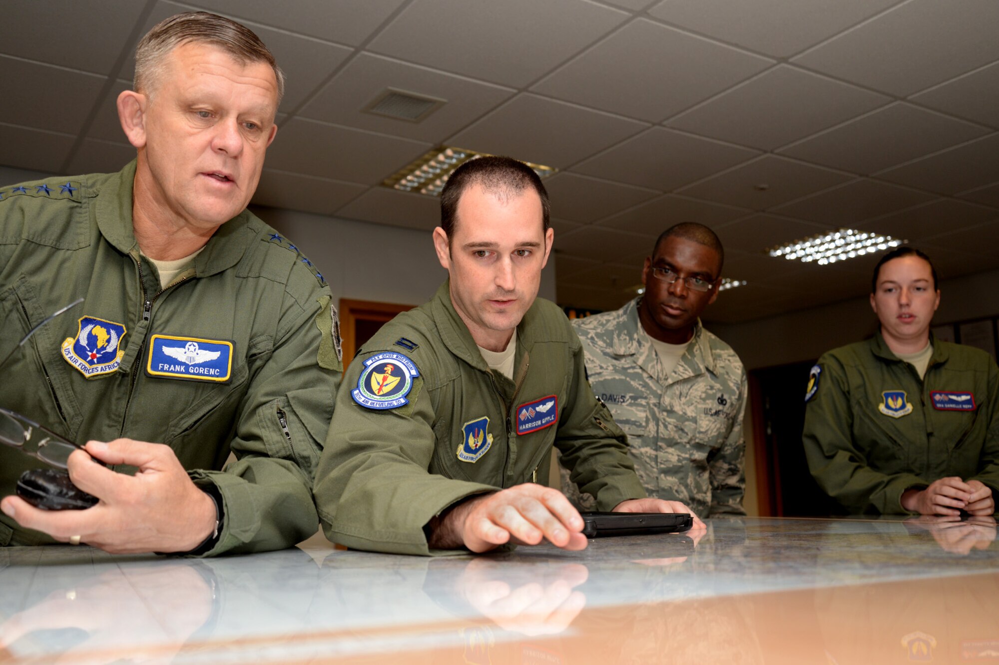 U.S. Air Force Airmen from the 351st Air Refueling Squadron brief U.S. Air Forces in Europe and Air Forces in Africa command leadership before their refueling flight Aug. 5, 2015, on RAF Mildenhall, England. U.S. Air Force Gen. Frank Gorenc, USAFE-AFAFRICA commander, and U.S. Air Force Chief Master Sgt. James Davis, USAFE-AFAFRICA command chief, visited several facilities and a variety of Airmen for a better understanding of Team Mildenhall and its mission. The two leaders also participated in a refueling flight and held an all-call to strengthen the relationship between RAF Mildenhall and its major command. (U.S. Air Force photo by Senior Airman Kate Thornton/Released)