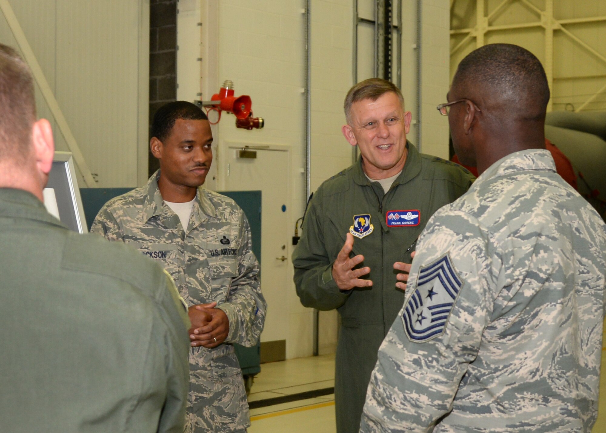 U.S. Air Force Gen. Frank Gorenc, center, U.S. Air Forces in Europe and Air Forces in Africa commander, and U.S. Air Force Chief Master Sgt. James Davis, right, USAFE-AFAFRICA command chief, Aug. 5, 2015, discuss training program improvements created by the 100th Maintenance Group Training section for new Airmen on RAF Mildenhall, England. Gorenc and U.S. Air Force Chief Master Sgt. James Davis, USAFE-AFAFRICA command chief, toured several facilities and met a variety of Airmen to learn more about the base’s overall mission. (U.S. Air Force photo by Tech. Sgt. Krystie Martinez/Released)