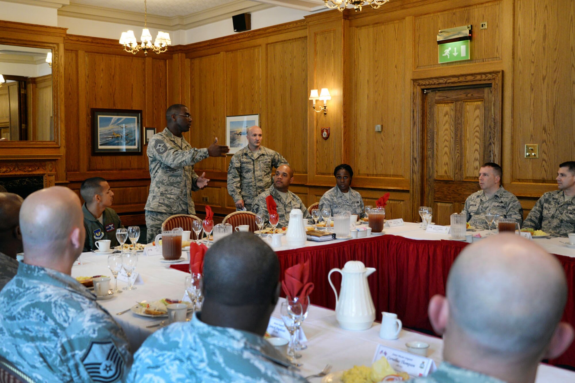 U.S. Air Force Chief Master Sgt. James Davis, U.S. Air Forces in Europe and Air Forces Africa command chief, speaks during a lunch held with Team Mildenhall senior NCO’s Aug. 5, 2015, on RAF Mildenhall, England. Davis and U.S. Air Force Gen. Frank Gorenc, USAFE-AFAFRICA commander toured several facilities and met a variety of Airmen to learn more about the base’s overall mission.  (U.S. Air Force photo by Senior Airman Christine Halan/Released)