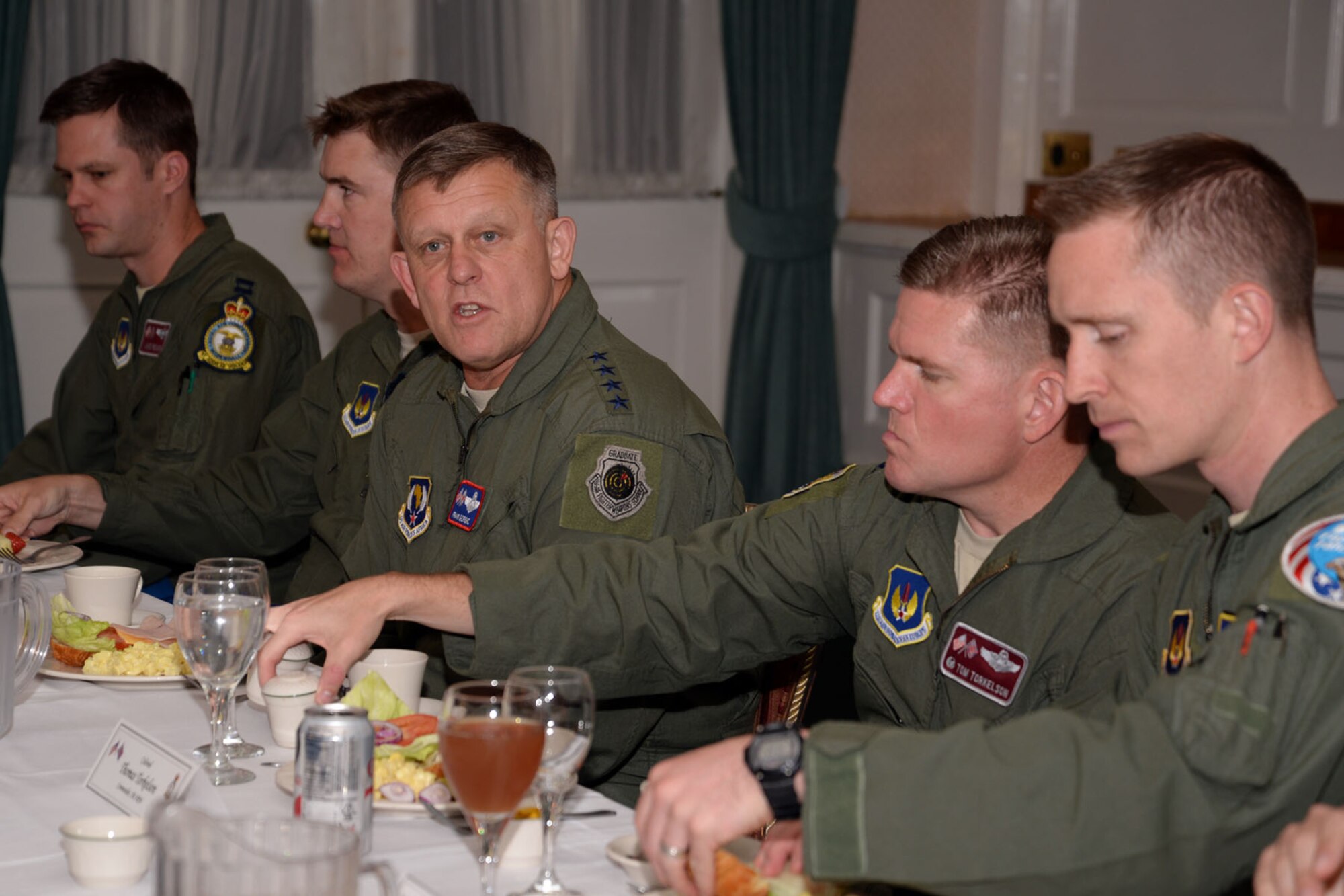 U.S. Air Force Gen. Frank Gorenc, center, U.S. Air Forces in Europe and Air Forces Africa commander, speaks during a lunch held with Team Mildenhall company grade officers Aug. 5, 2015, on RAF Mildenhall, England. Gorenc and U.S. Air Force Chief Master Sgt. James Davis, USAFE-AFAFRICA command chief, toured several facilities and met a variety of Airmen to learn more about the base’s overall mission. (U.S. Air Force photo by Senior Airman Christine Halan/Released)