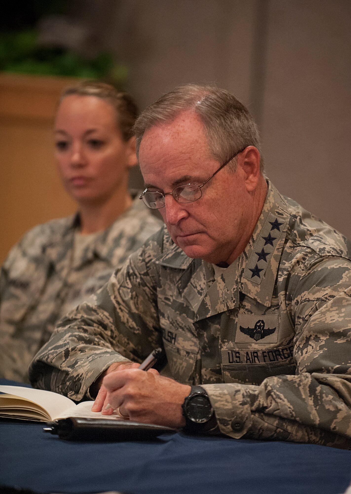 Air Force Chief of Staff Gen. Mark A. Welsh III writes down questions posed by Airmen during a visit to the 5th Bomb Wing and 91st Missile Wing at Minot Air Force Base, N.D., Aug. 5, 2015. Welsh is the 20th Chief of Staff of the U.S. Air Force and serves as the senior uniformed Air Force officer responsible for the organization, training and equipping of 664,000 active-duty, guard, reserve and civilian forces serving in the United States and overseas. (U.S. Air Force photo/Senior Airman Stephanie Morris)