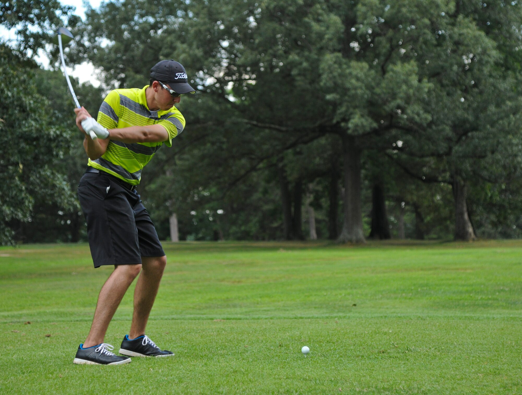Senior Airman Chantin Miles, 11th Security Forces Squadron patrolman, drives a golf ball at The Courses at Andrews 18th hole, Aug. 4, 2015, during the Joint Base Andrews intramural golf championship. 11th Security Forces Squadron beat the 201st Air National Guard Air Lift Squadron. (U.S. Air Force photo/ Airman 1st Class J.D. Maidens)