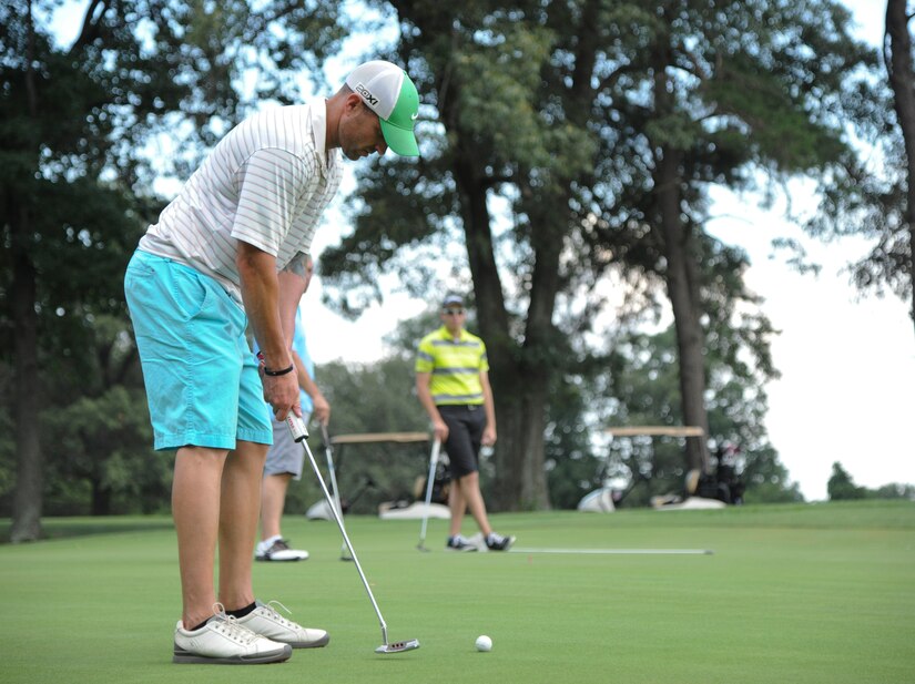 Tech. Sgt. Ryan Wenger, 811th Security Forces Squadron flight sergeant, putts at the The Courses at Andrews’ 18th hole, Aug. 4, 2015, during the Joint Base Andrews intramural golf championship. 11th Security Forces Squadron beat the 201st Air National Guard Air Lift Squadron. (U.S. Air Force photo/ Airman 1st Class J.D. Maidens)